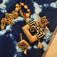 N0560_Classic temple jewelry style Mangal sutra design gold plated necklace set embellished with ruby stones .