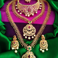 N01176_Grand Lovely designer Gold polished 3 set of Necklaces  embellished with American diamond stones with delicate White & ruby Stones .