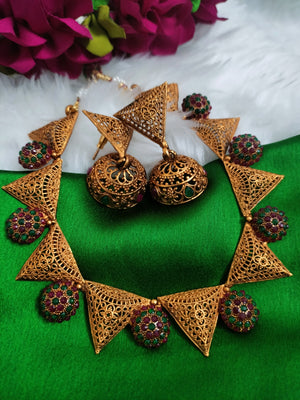 N0562_Classic temple jewelry style crafted design gold plated necklace set embellished with ruby stones .