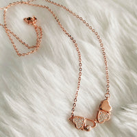 N01204_ Magnetic elegant design Rose gold Polished American Diamond pendant necklace studded with beautiful dazzling stones .