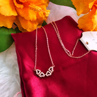 N01205_ Magnetic elegant design Rose gold Polished American Diamond pendant necklace studded with beautiful dazzling stones .