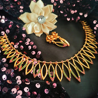 N0564_1_Classic matte gold polished temple jewelry style crafted design gold plated necklace set embellished with ruby and green stones .