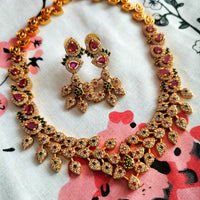 N0563_Classic matte gold polished temple jewelry style crafted design gold plated necklace set embellished with ruby and green stones .