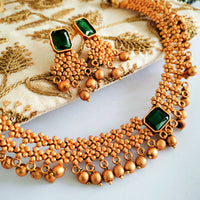 N03019_Classic matte gold polished temple jewelry style  crafted design gold plated necklace set embellished with green stones .