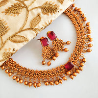 N03018_Classic matte gold polished temple jewelry style  crafted design gold plated necklace set embellished with ruby stones .
