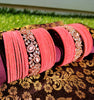 B02005_Elegant flowery design Bangles studded with American Diamond stones with a touch of baby pink stones with delicate stone work. Also 2 Dozens of pink velvet bangles