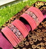 B02005_Elegant flowery design Bangles studded with American Diamond stones with a touch of baby pink stones with delicate stone work. Also 2 Dozens of pink velvet bangles