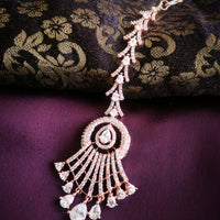 M028_Elegant designer rose gold American diamond studded Maang tika with delicate stone work.