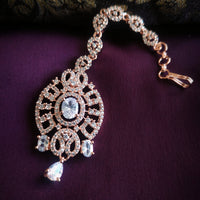 M056_Lovely designer  American diamond studded rose gold polished Maang tika with a touch of white stones.