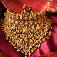 N03065_Grand Choker classic matte gold polished temple jewelry style crafted design gold plated necklace set embellished with ruby and green stones .