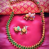 N03024_Reversible classic matte gold polished long temple jewelry style crafted design gold plated necklace set embellished with ruby and green stones .