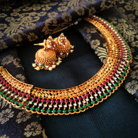 N03026_ classic matte gold polished temple jewelry choker style crafted design gold plated necklace set embellished with ruby and green stones .