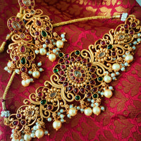 N03038_ classic matte gold polished temple jewelry choker style crafted design gold plated necklace set embellished with ruby and green stones .