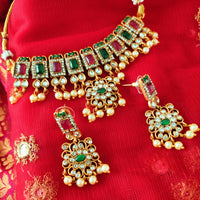 N03025_ classic matte gold polished temple jewelry choker style crafted design gold plated necklace set embellished with ruby and green stones .
