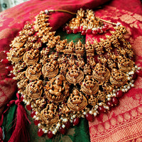N03083_Grand Choker classic matte gold polished temple jewelry style crafted design gold plated necklace set embellished with red stones .