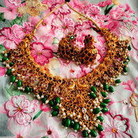 N03070_ Grand classic matte gold polished temple jewelry choker style and Long Haram crafted design gold plated necklace set embellished with ruby and green stones .