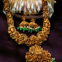 N03078_ Grand classic matte gold polished temple jewelry Long Haram & grand choker crafted design gold plated necklace set embellished with green stones .