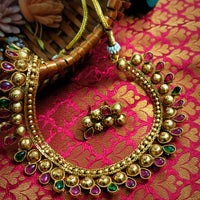N03016_Classic matte gold polished temple jewelry style crafted design gold plated necklace set embellished with ruby and green stones .