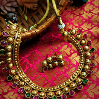 N03016_Classic matte gold polished temple jewelry style crafted design gold plated necklace set embellished with ruby and green stones .