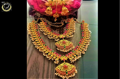 N059_Ravishing Temple jewelry Bridal set studded with semi precious pink and green  stones and beads.