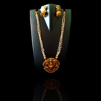 N068_Gorgeous matte Gold polish Temple jewelry design Lakshmi pendant  necklace studded with pink and green ruby stones followed by small pearls.