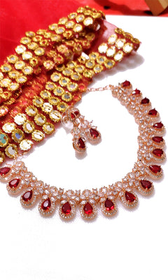 N0543_Lovely rose gold choker necklace embellished with american diamond stones with a touch of  red stones.