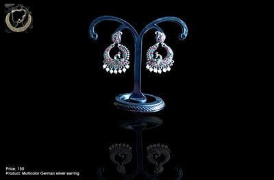 Silver oxidized earrings with exclusive silver peacock  work for a stunning and stylish look.